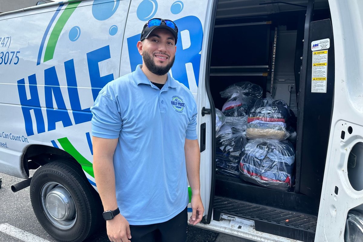 Half Price Laundry driver with the pickup and delivery van